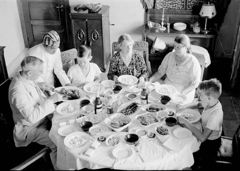 Dutch family enjoying rijstaffel